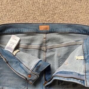 MOTHER The Undercover Sneak patch pocket wide leg jeans.
